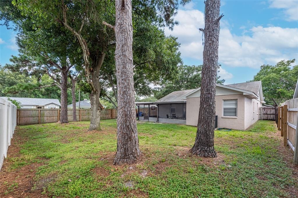 Yard is shaded and completely fenced with a gate to the front yard.