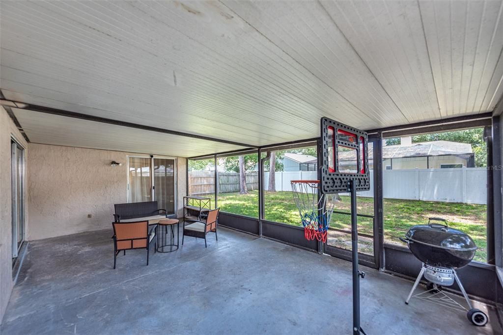 Large screened and enclosed lanai with sliding door from the living room and owner's retreat.