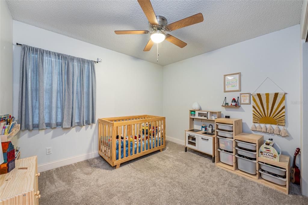 Secondary bedroom #2 is 11' x 10' with a built-in closet, carpet and ceiling fan.