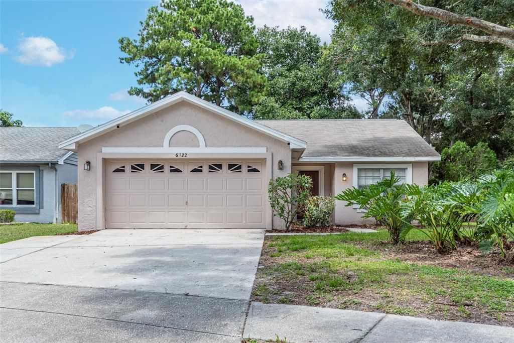 2 car garage plus attic space!  NO CDD! LOW HOA! Fully fenced rear yard with a gate on a shaded corner lot! ROOF WILL BE REPLACED BEFORE CLOSING.