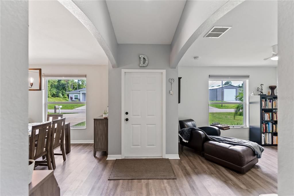 Entry boasts easy access to dining room on the right, and office on the left, while the vaulted hall compels you forward to all that is ahead.