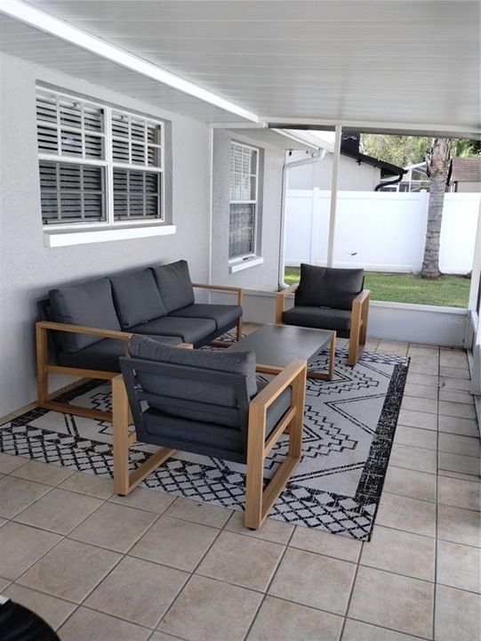 Screened rear patio has ceramic tile!