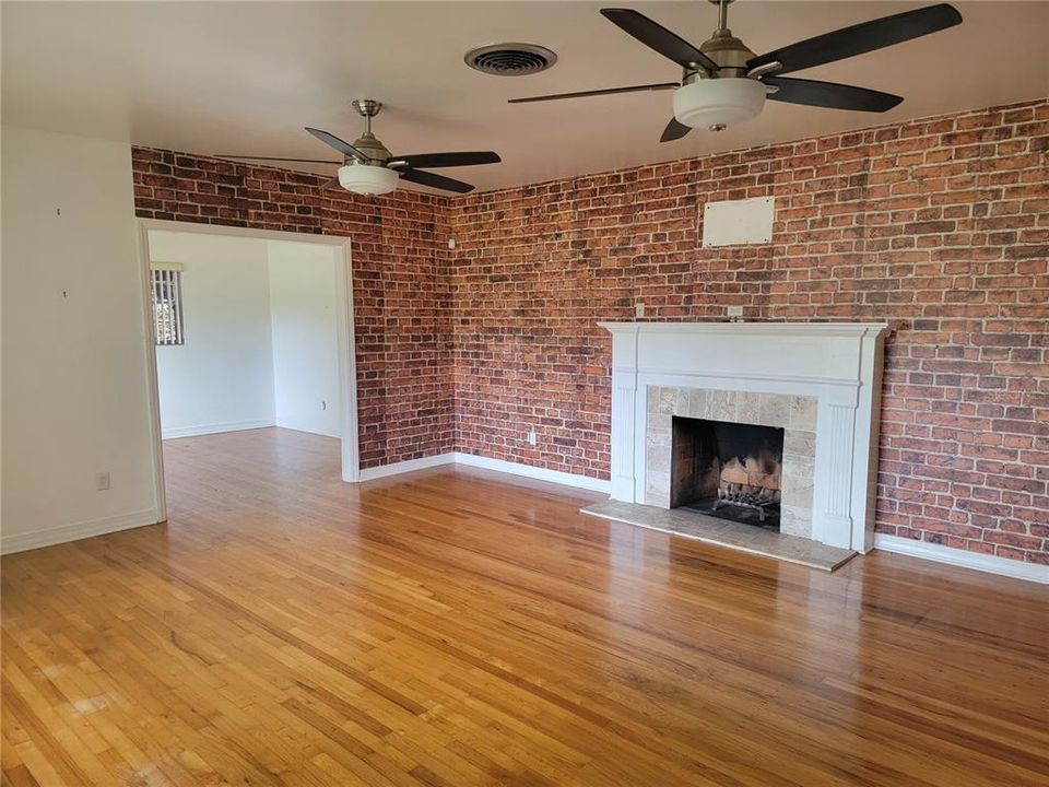 Formal living room with wood burning fireplace