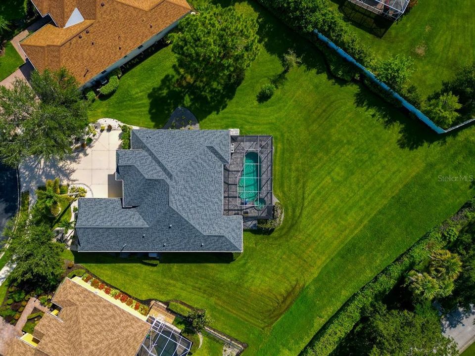 Aerial of new roof and private, spacious lot.