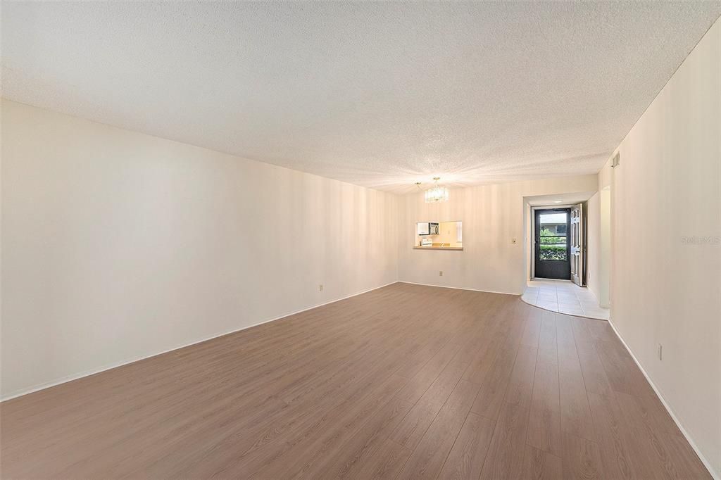 View of the Dining and Living Room Combination with New Laminate Flooring