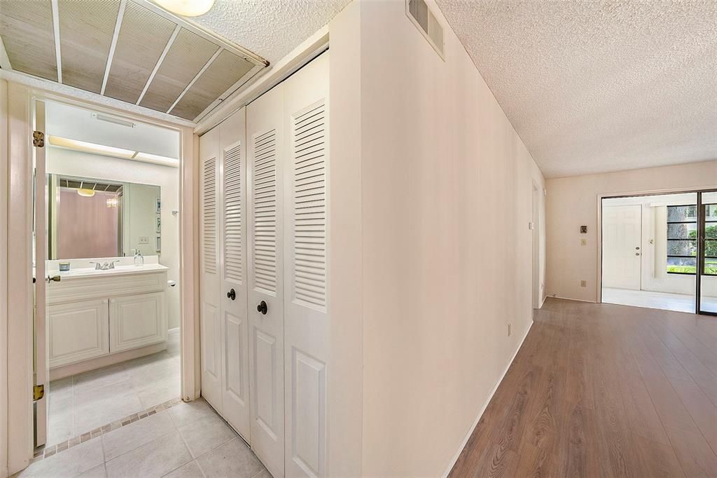 Hall into the secondary bathroom and laundry closet