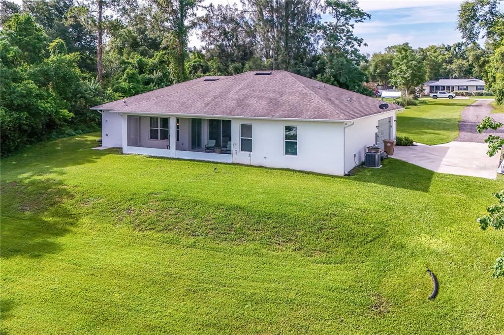 Rear view of home with plenty of parking at right.