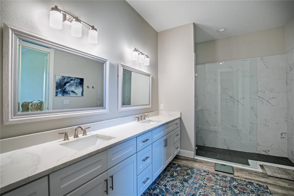 Ensuite bath towards large walk-in shower.