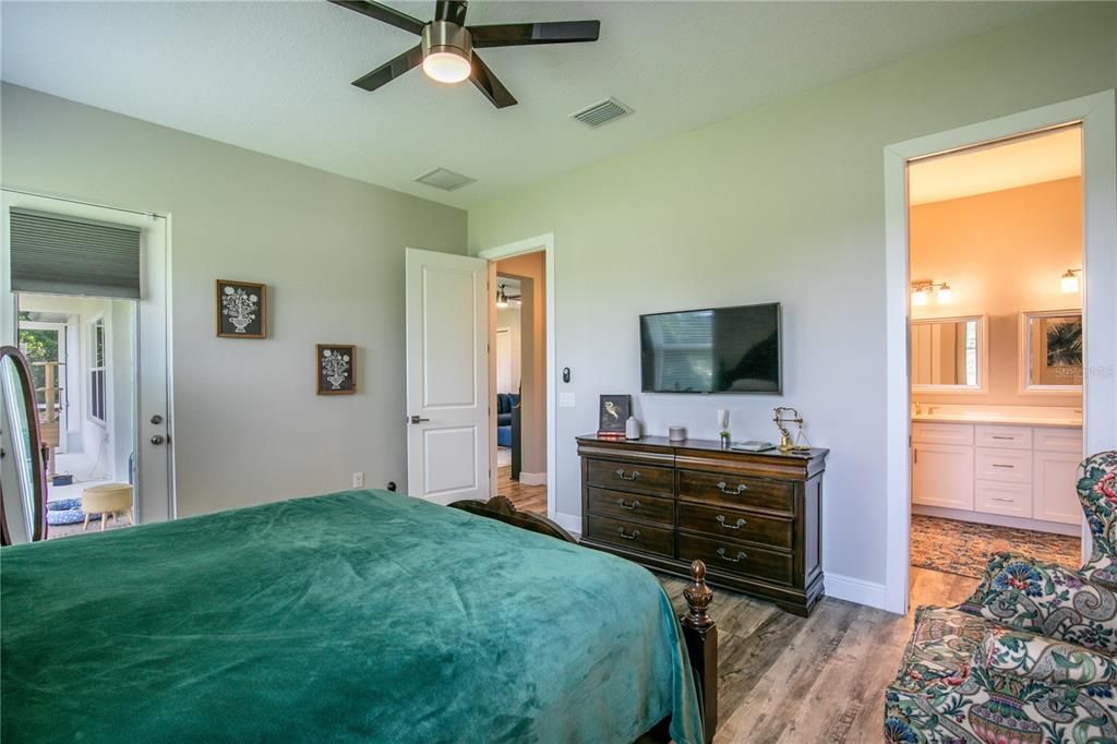 Primary suite. Lanai entrance (left), entrance (center), and ensuite bath (right).