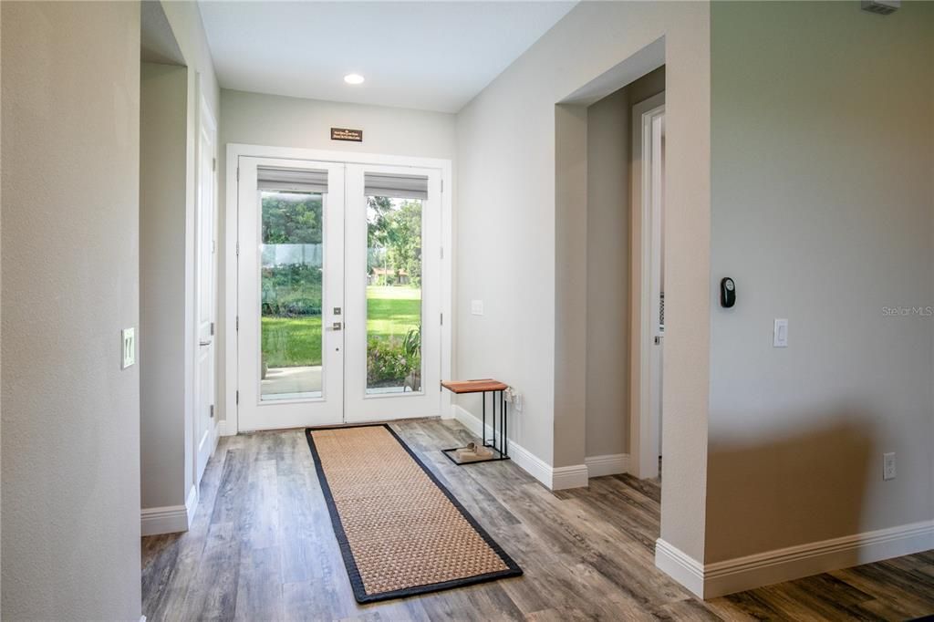 Front entrance. Laundry room at right, bedrooms #3, and #4 at left.