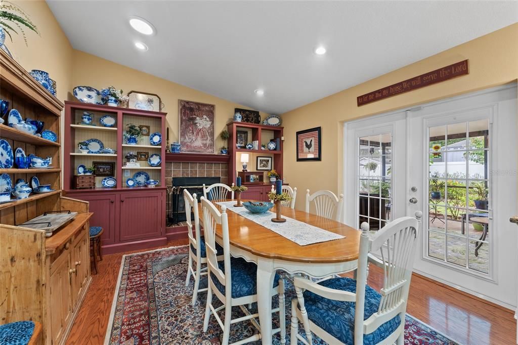 Dining with fireplace off of kitchen