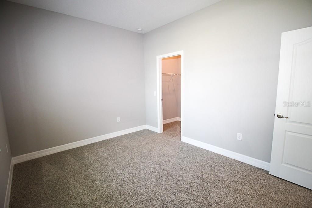 Bedroom 2 with walk-in closet