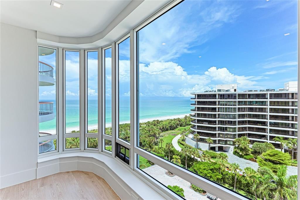 Wake up to stunning beach and bay views through the expansive windows in the master bedroom.