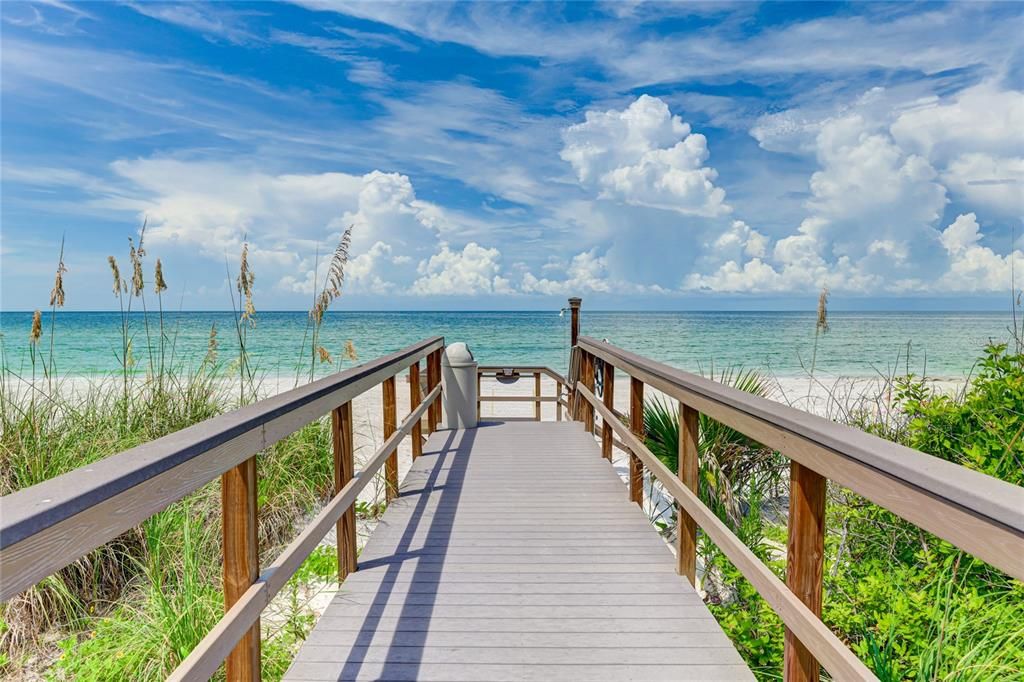 A community pier provides direct access to the stunning beach