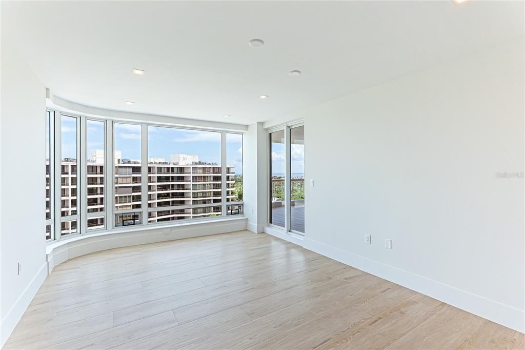 Step out onto the balcony from the master bedroom and enjoy panoramic views of the beach and bay.