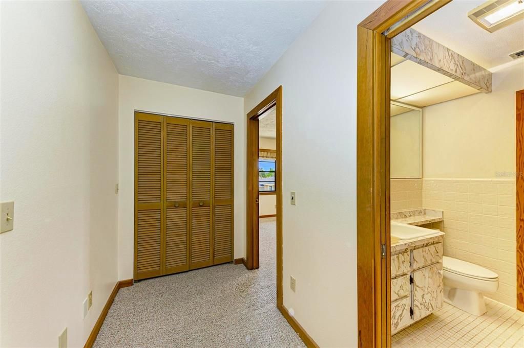 UPSTAIRS wide HALLWAY & BIG CLOSETS. More room to remodel bathrooms.