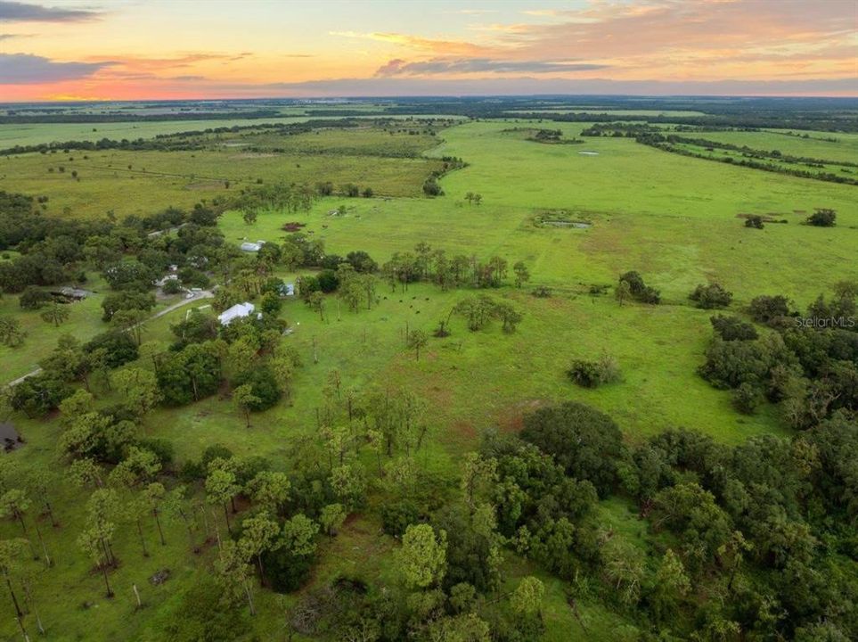 Aerial view of the property and surrounding land.