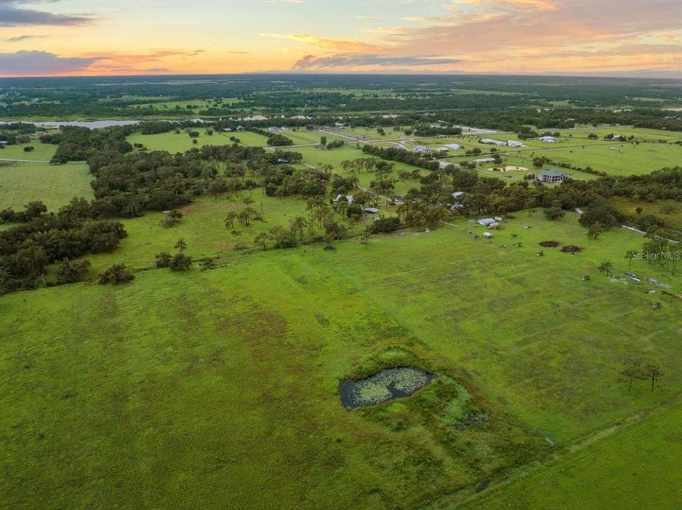 Aerial view of the property and surrounding land.