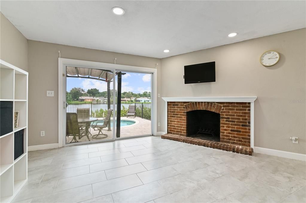 Kitchen view of the fireplace and lake