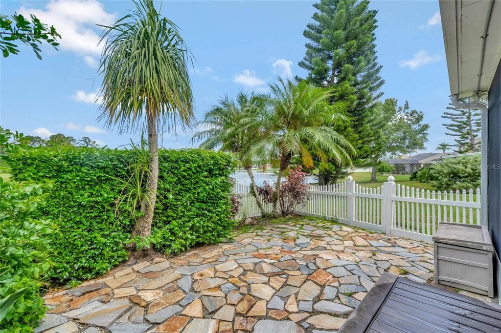 Tropical Rear Yard and Stone Patio Area