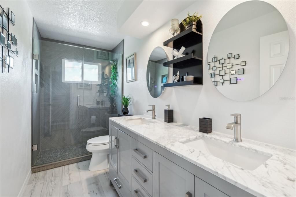 Additional full bathroom upstairs near media room recently updated and includes a large walk-in shower