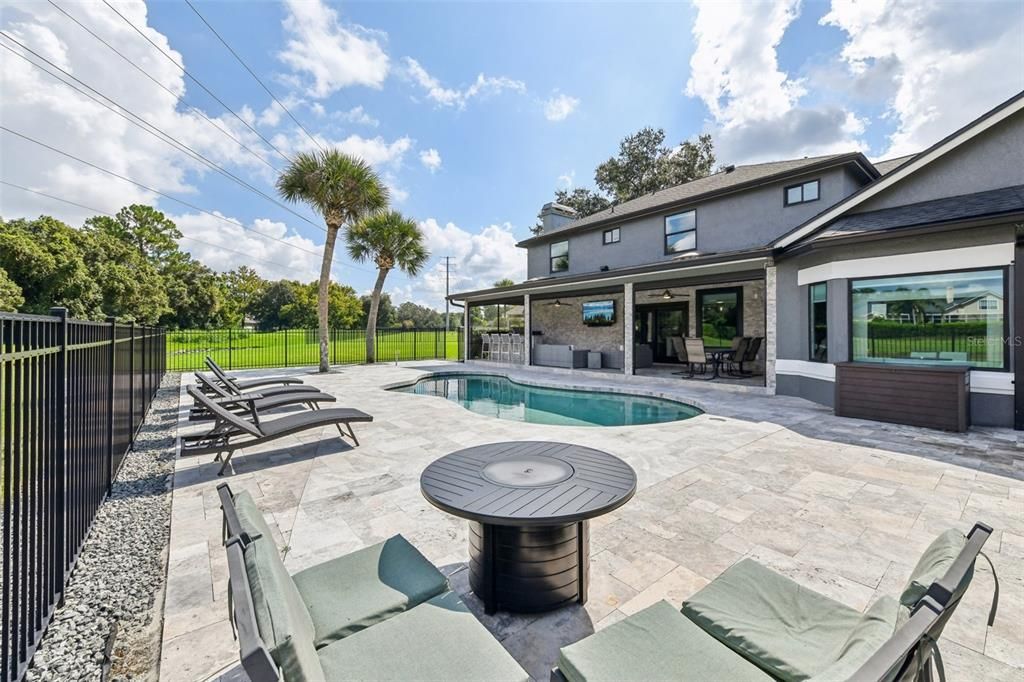 View of the back of the home from the pool