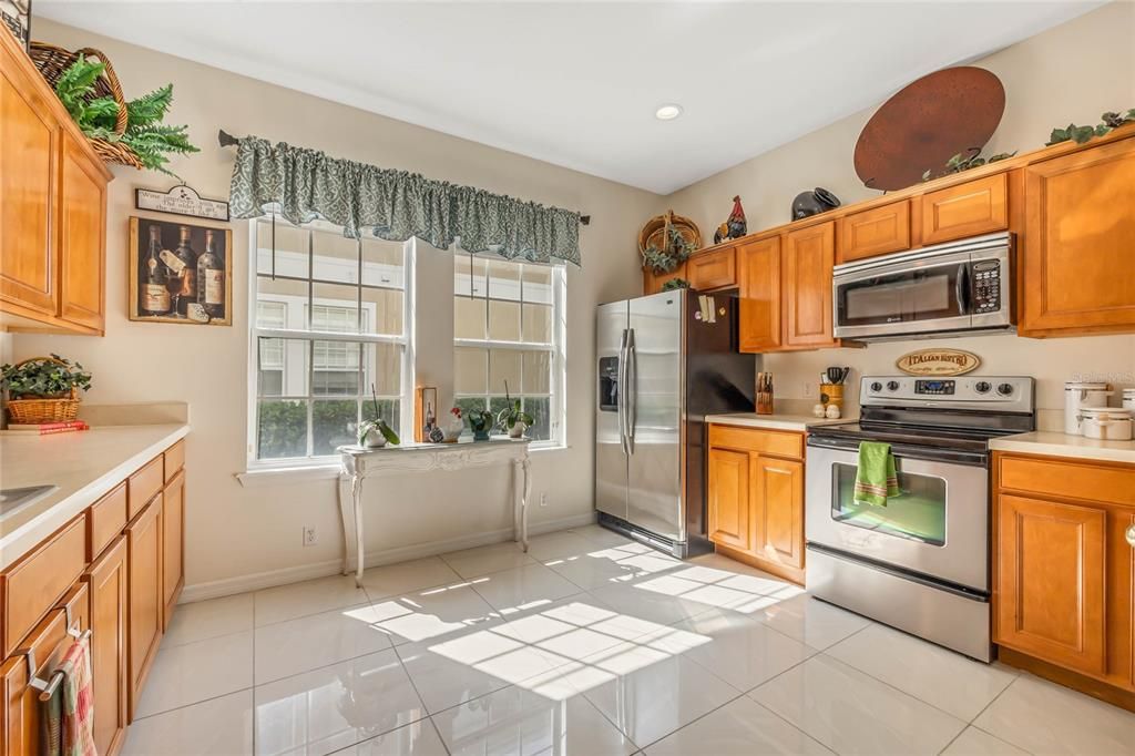 The family chef will fall in love with the spacious kitchen delivering additional casual dining at the breakfast bar, STAINLESS STEEL APPLIANCES, plenty of cabinet storage in addition to the pantry, solid surface counters and twin windows let the natural light pour in!