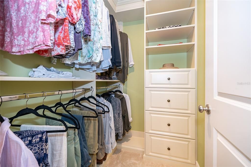 Primary closet with built in shelves