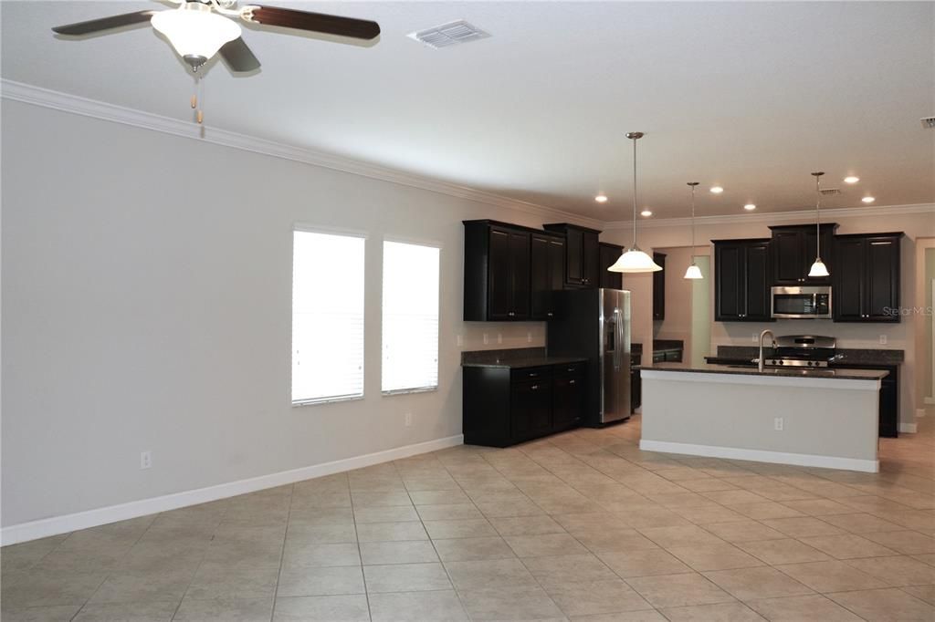 Another view of the kitchen and living room