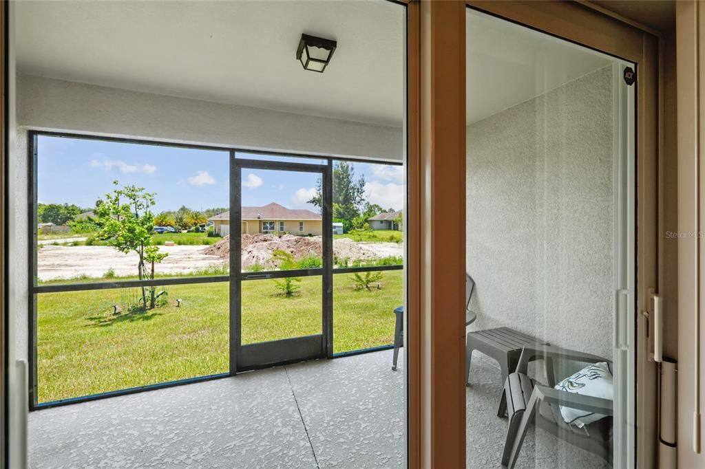 Screened in Lanai Sunroom featuring plenty of natural light