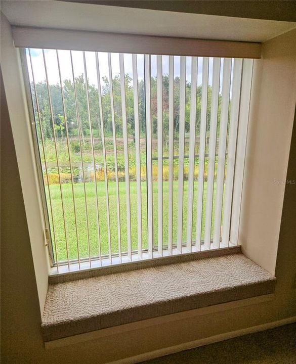 Window seat in dining area overlooks creek