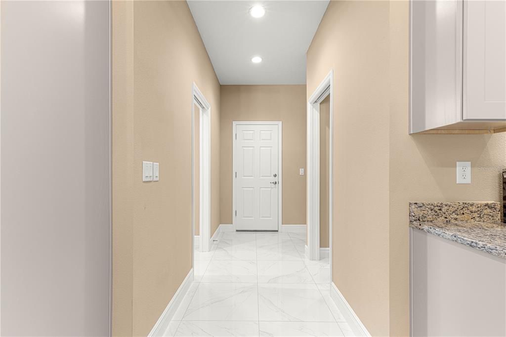 MUDROOM WITH PANTRY, LAUNDRY ROOM AND CUBBY AREA