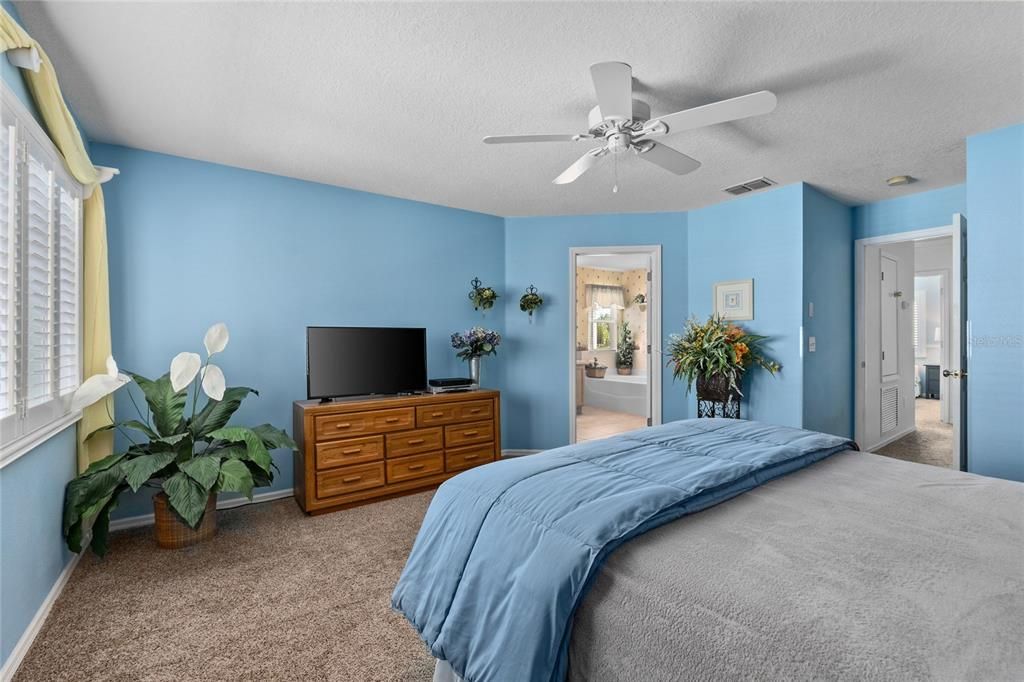 Master Bedroom with Plantation Shutters and a gorgeous Water view