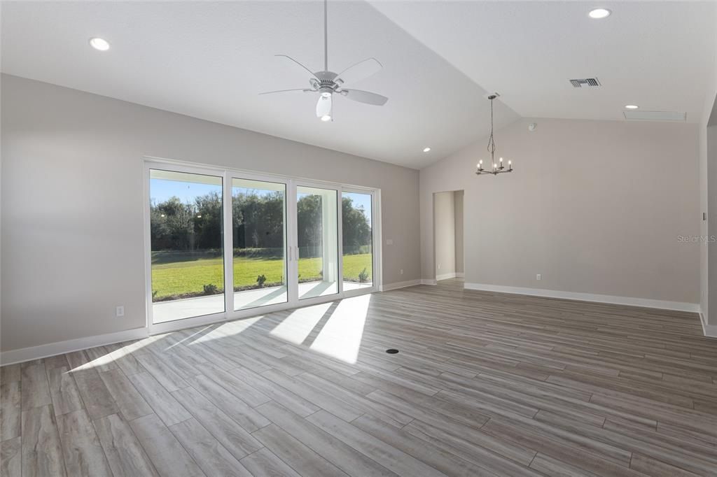 GREAT ROOM / LIVING & DINING - NEW ZEBRA ROLLER SHADE SYSTEM IN ORDER