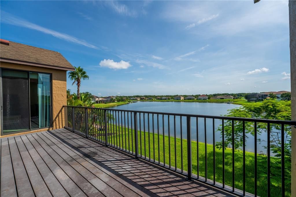 Second floor balcony overlooking water; two access points via sliding doors