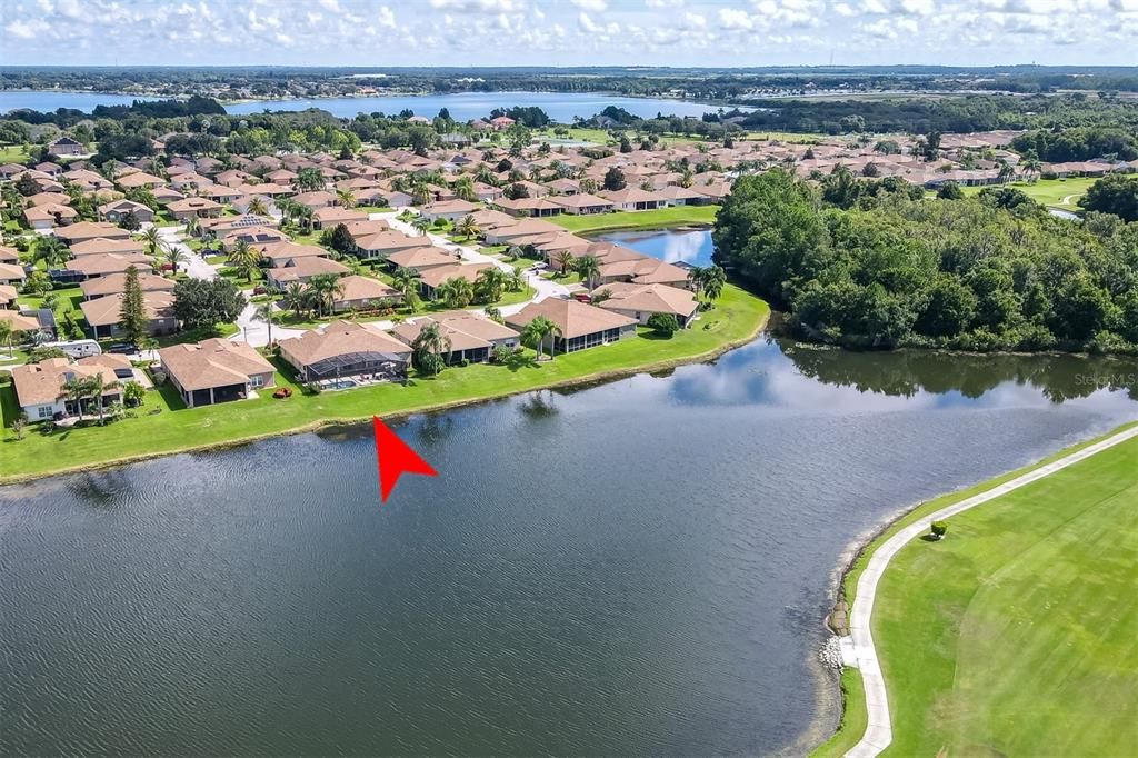 The large pond that is behind this home wraps around a nature preserve.