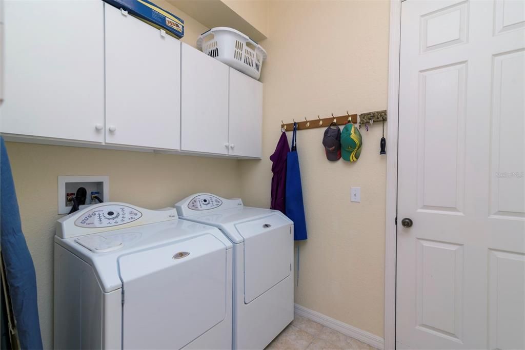 The inside laundry room doubles as the mud room for the attached 2 car with golf cart garage.