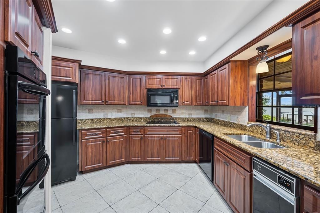 KITCHEN WITH GRANITE COUNTER TOPS