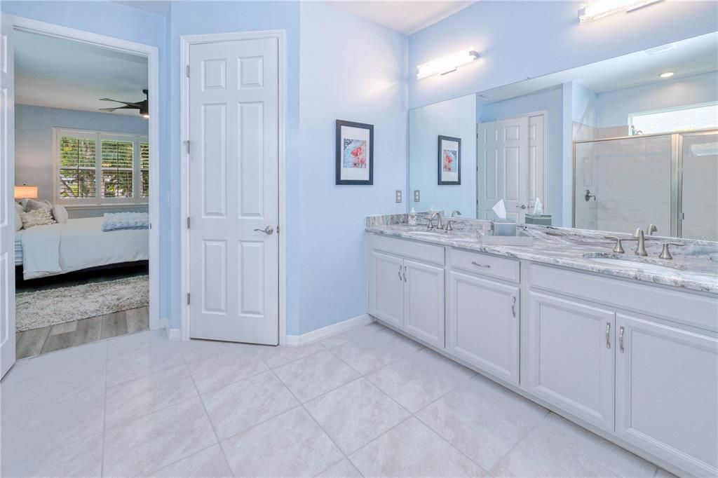 Primary ensuite double sink vanity with water closet