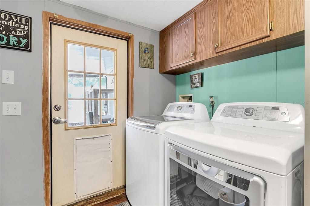 Laundry Room with a door to the back screened porch