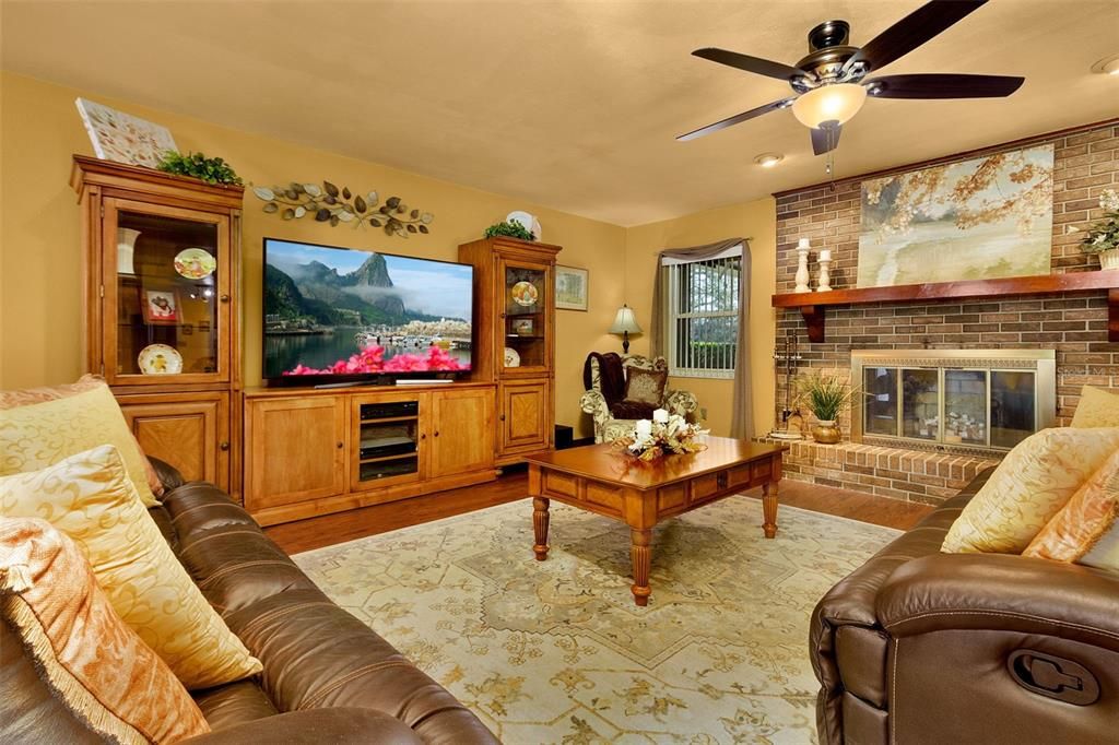 Living room with wood burning fireplace for those occasional chilly nights!