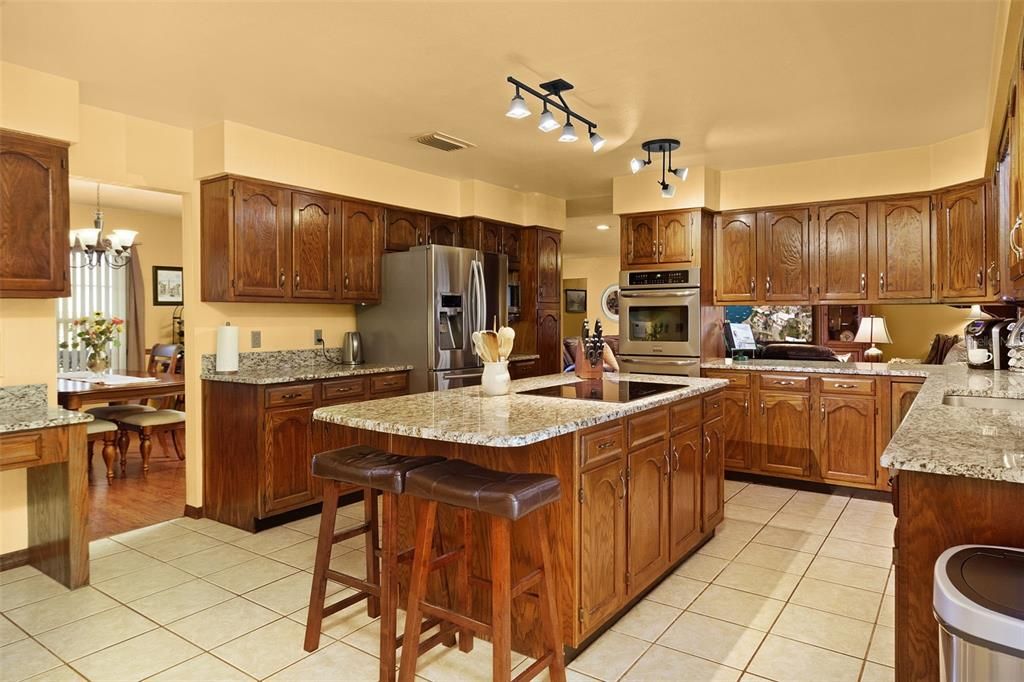 Huge kitchen with plenty of cabinets & counter space.