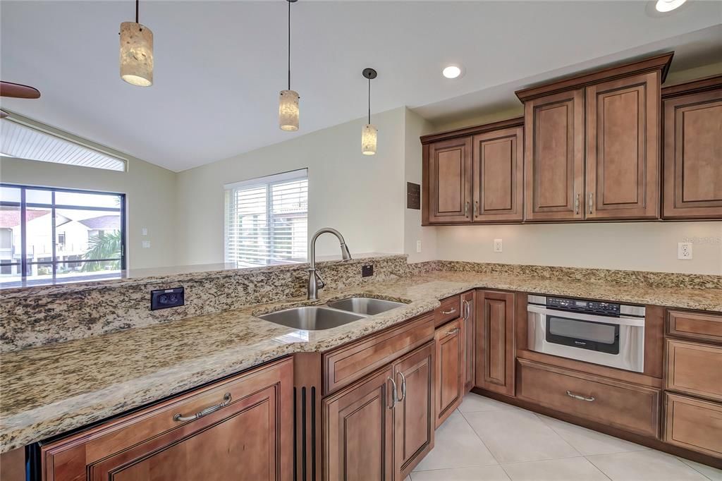 Updated kitchen with granite countertops.