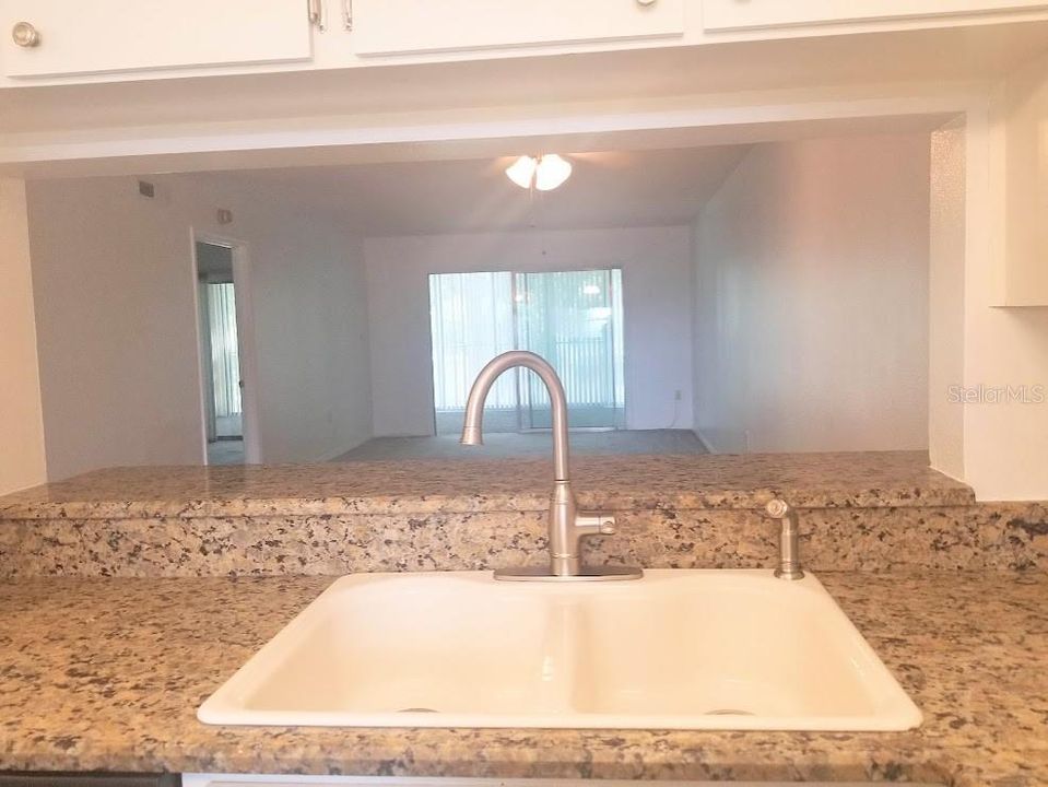 sink overlooking passthrough into main living space