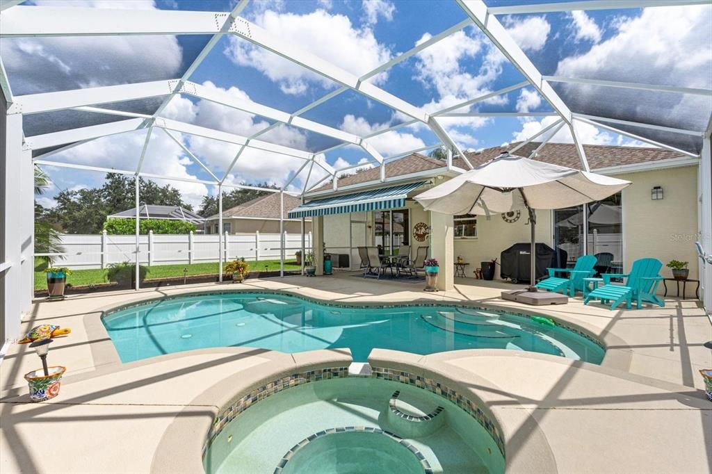 Caged lanai with heated saltwater pool and spa.