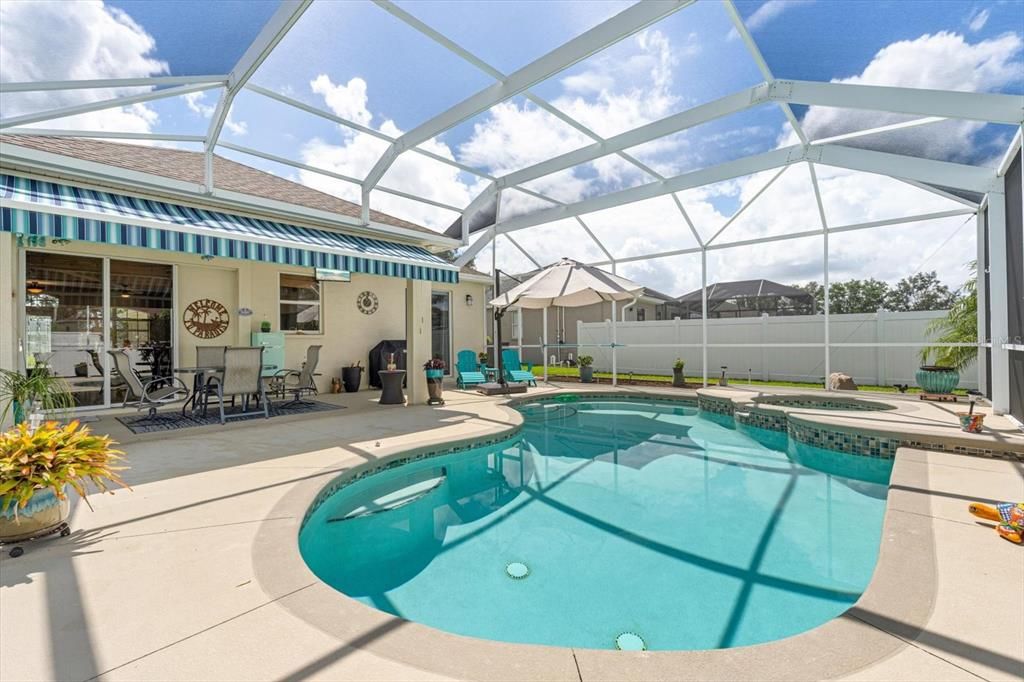 Caged lanai with heated saltwater pool and spa.