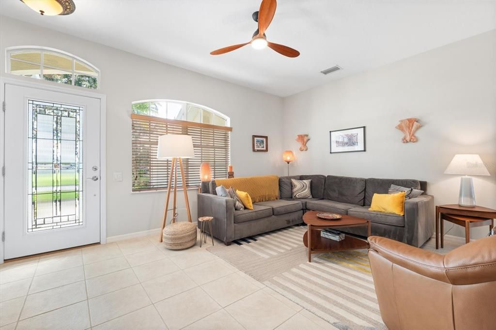 Great room with picture window and leaded glass front door.