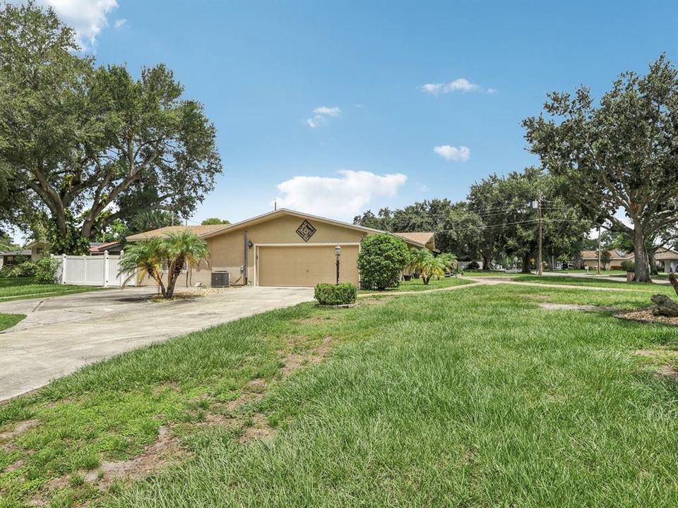 Side of house with driveway to garage