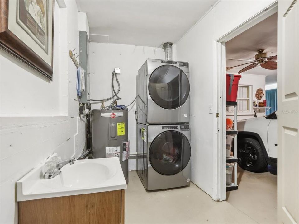 Laundry room in garage - new stacked washer and dryer