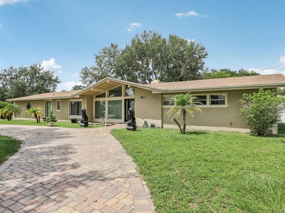 Front of house w/paved brick  driveway